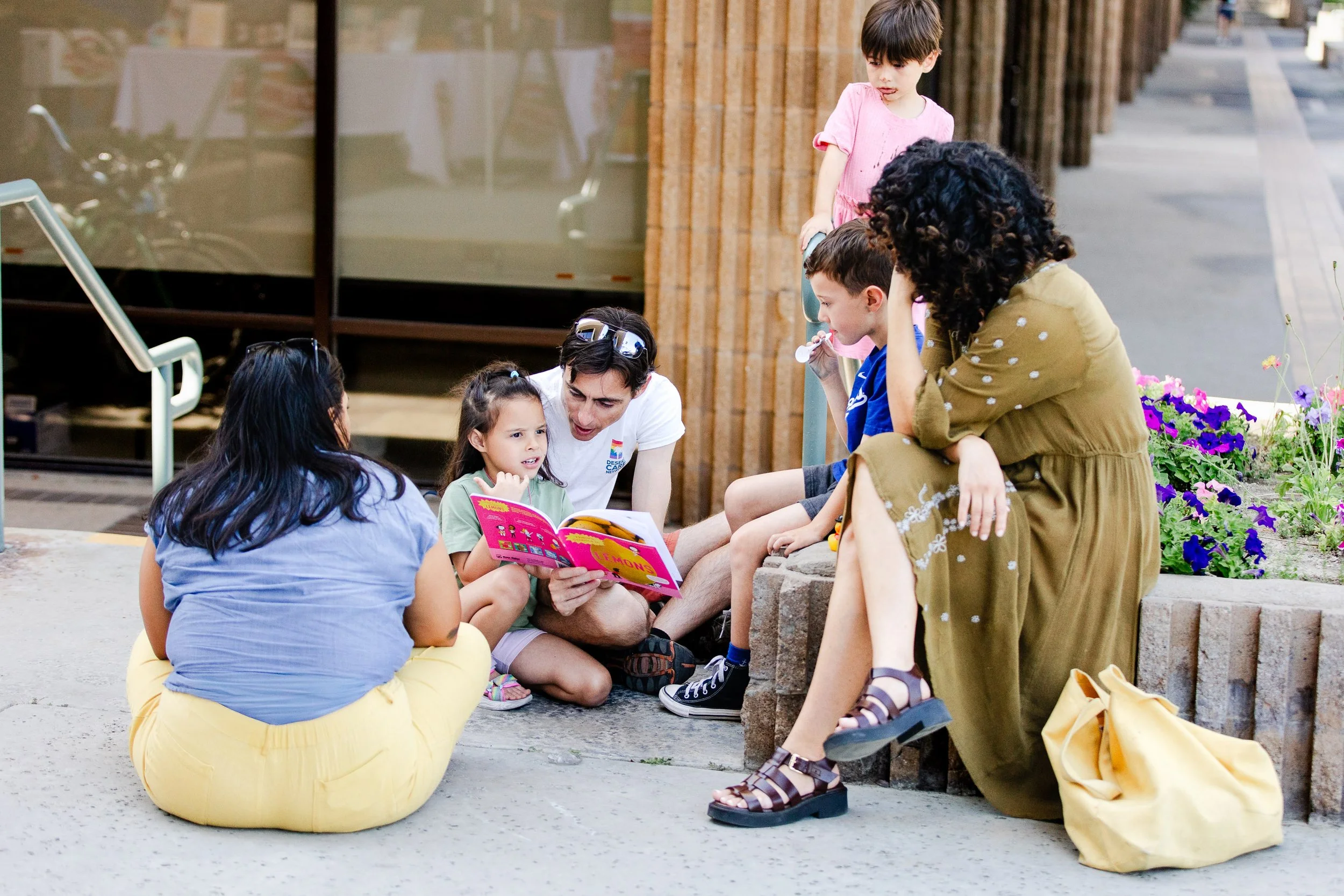 Families and children gathered together during a community storytelling moment at Palm Springs Book Fest.