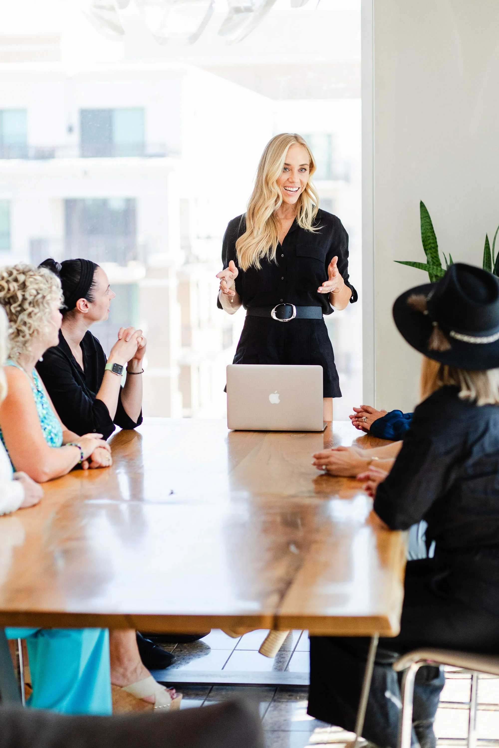 Professional woman speaking during meeting for a Los Angeles business lifestyle photo session