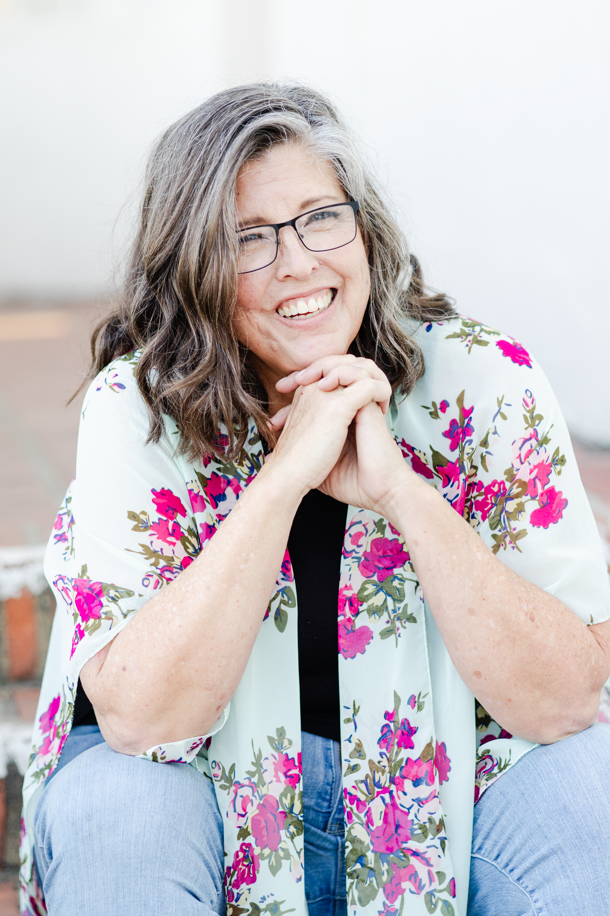 A portrait of an LMFT provider outside for her therapy business's brand photo session.