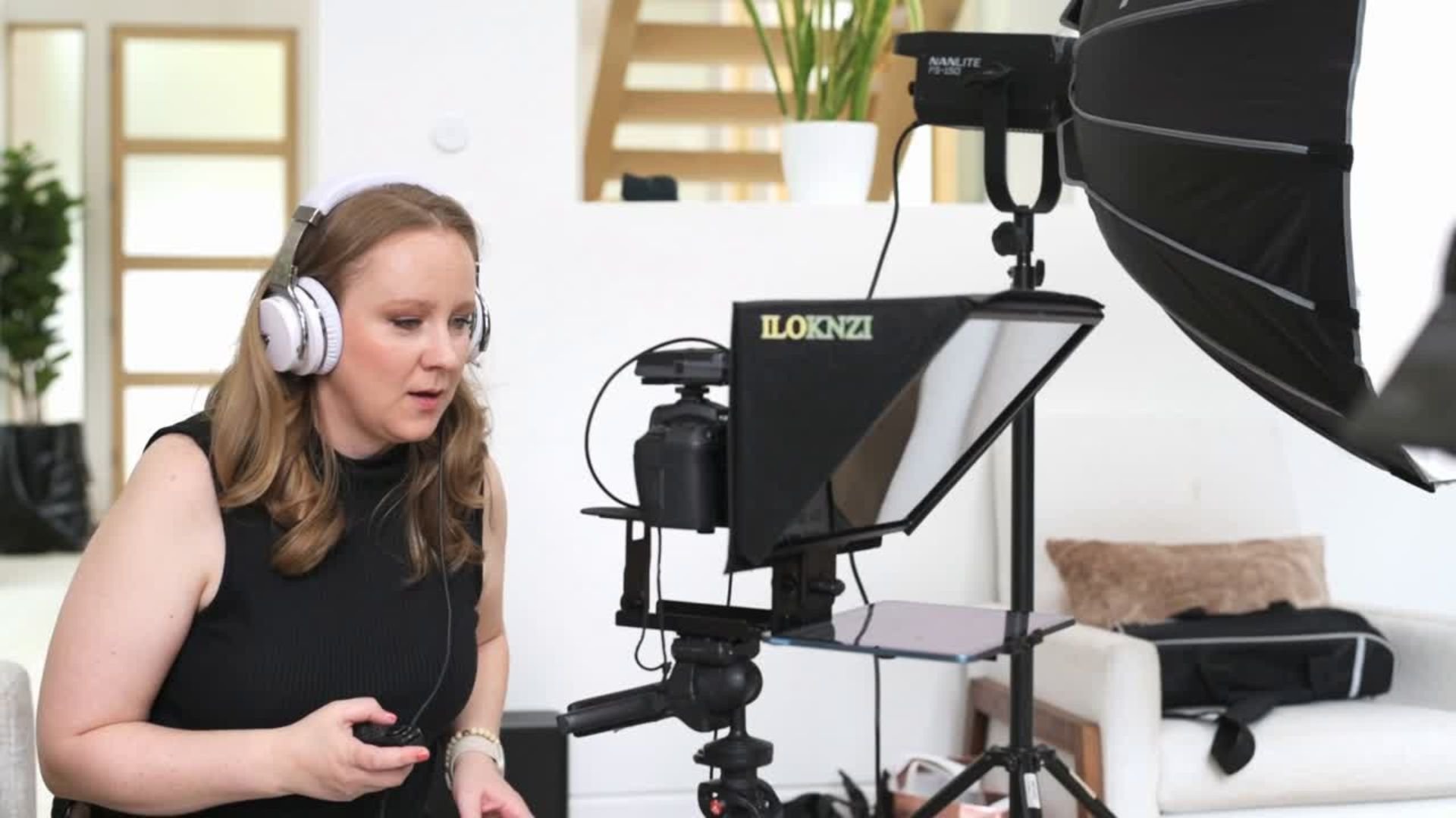 Solhaus Media founder directing a brand video using a teleprompter on set.