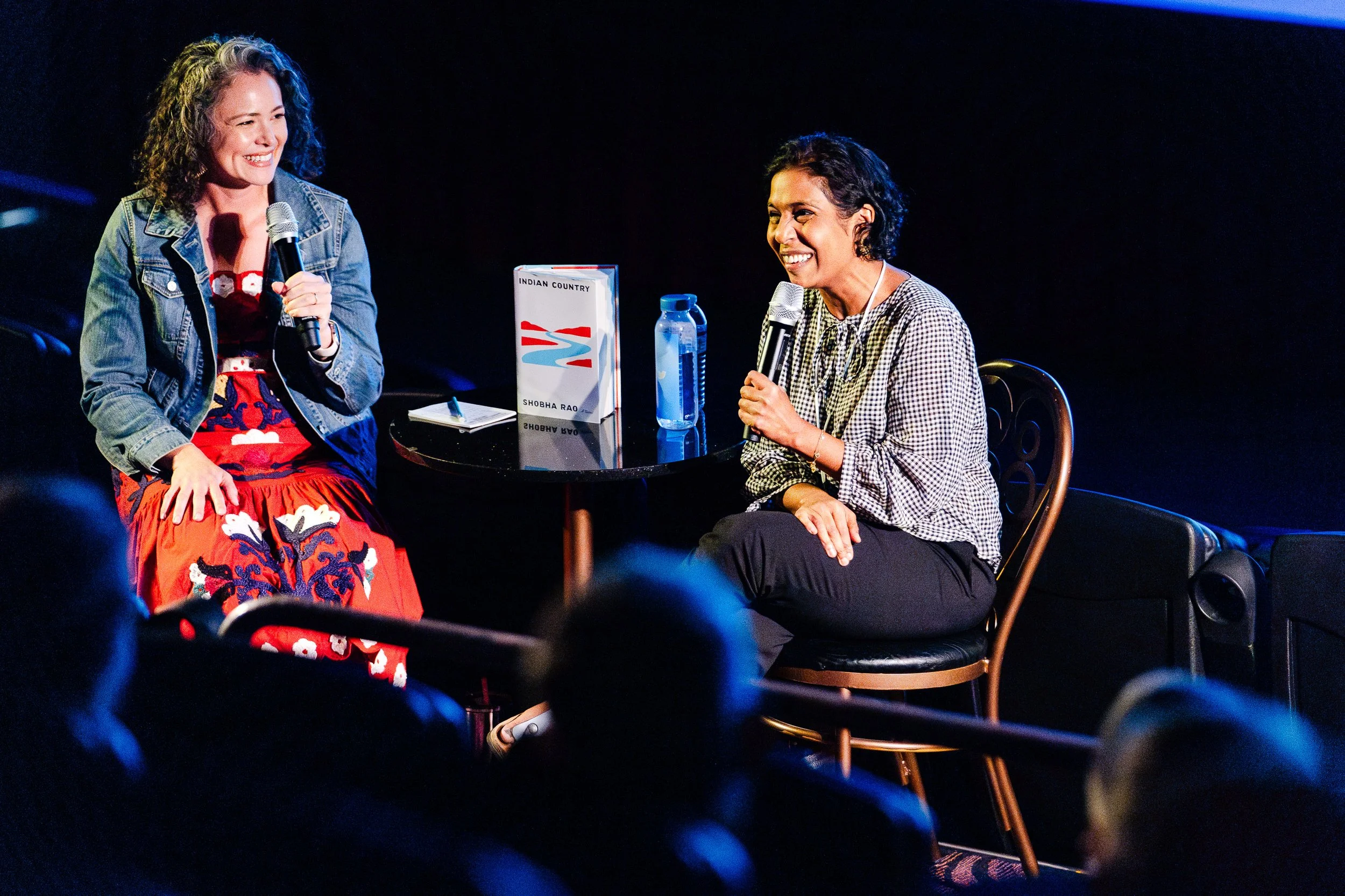 Speaker participating in an author conversation onstage at Palm Springs Book Fest.