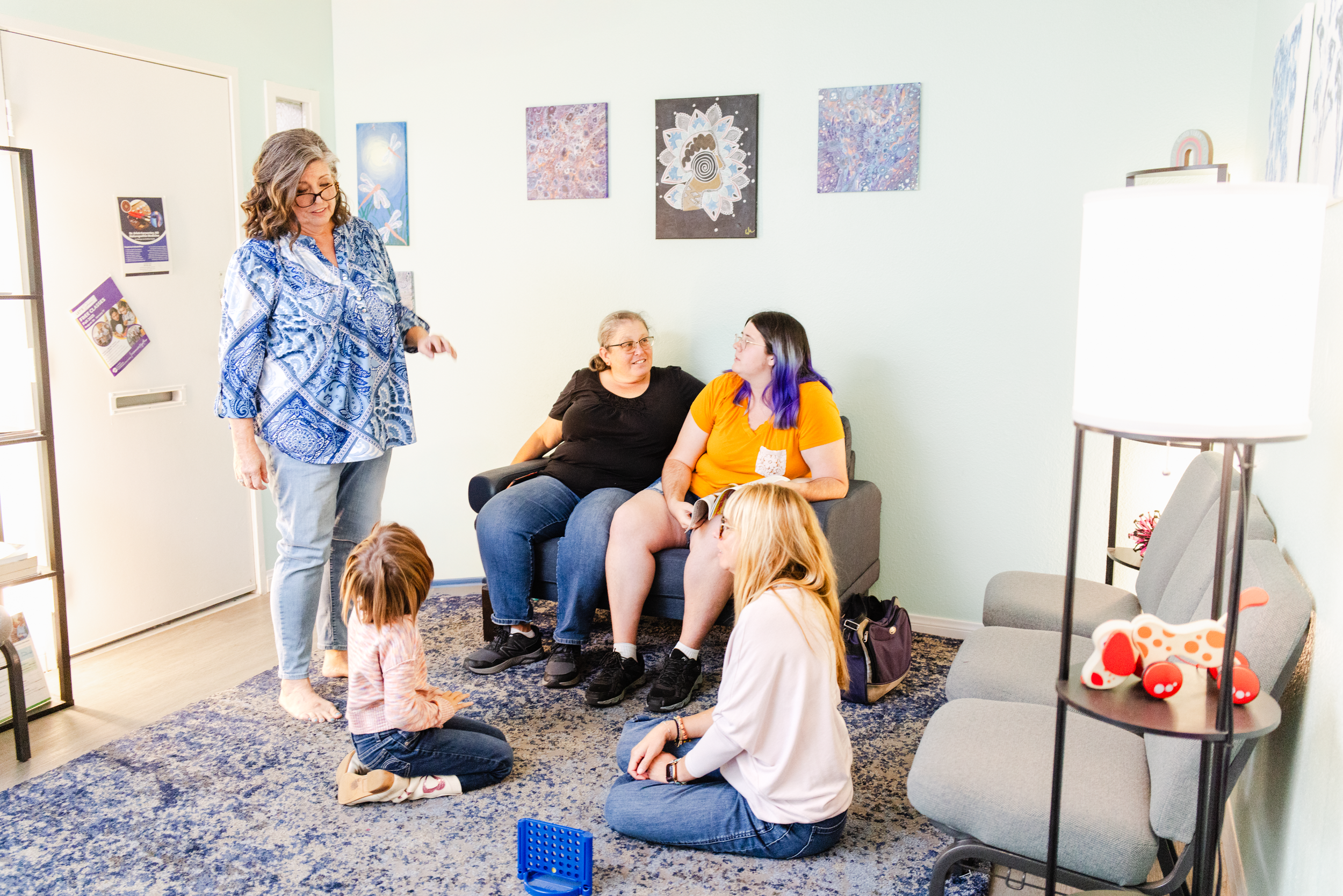 Clients congregate in the waiting room of a therapist for her brand photo shoot.