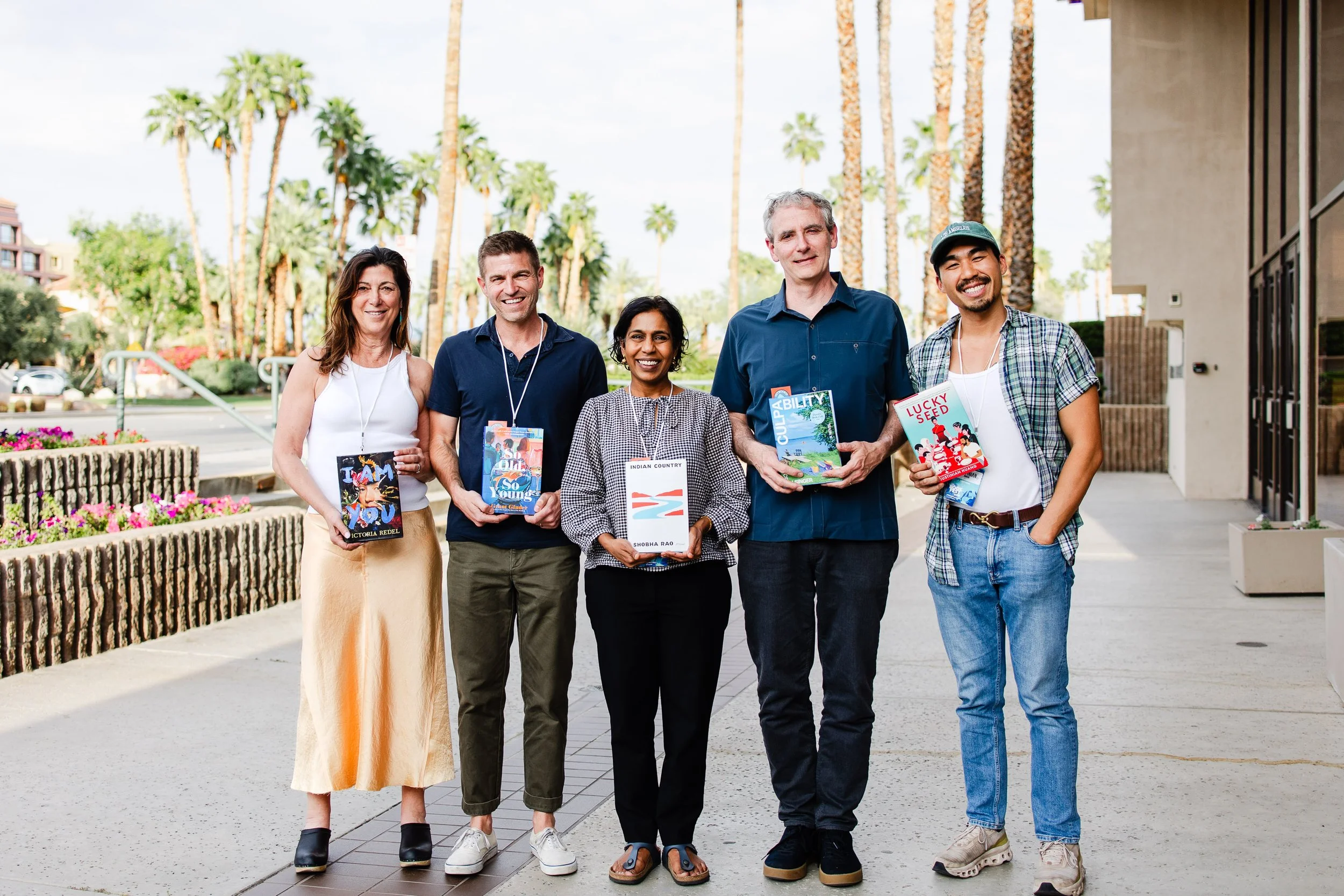 Authors and attendees posing together outside the Palm Springs Festival Theaters.
