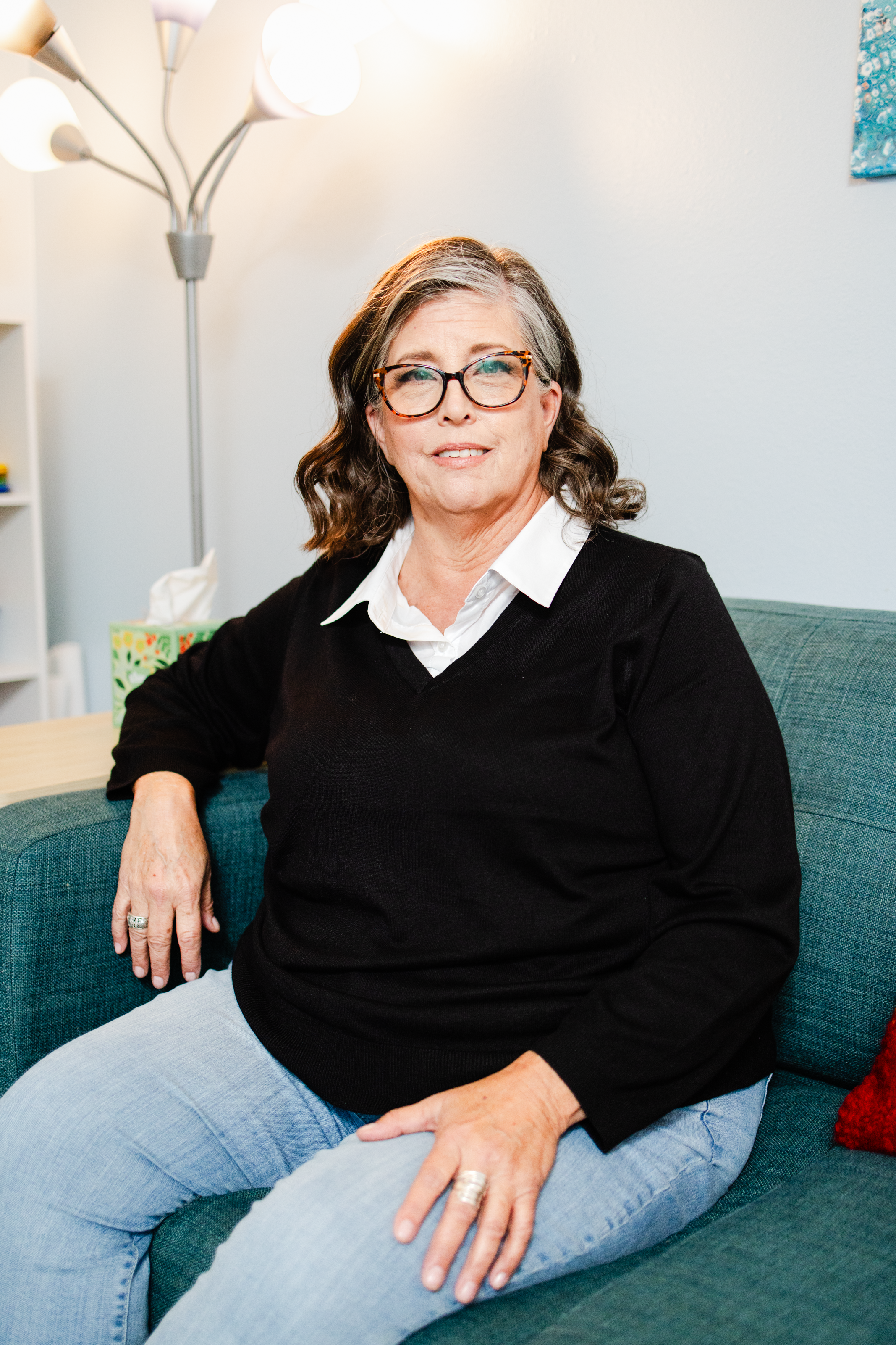 A portrait of an LMFT provider in her office for her therapy business's brand photo session.