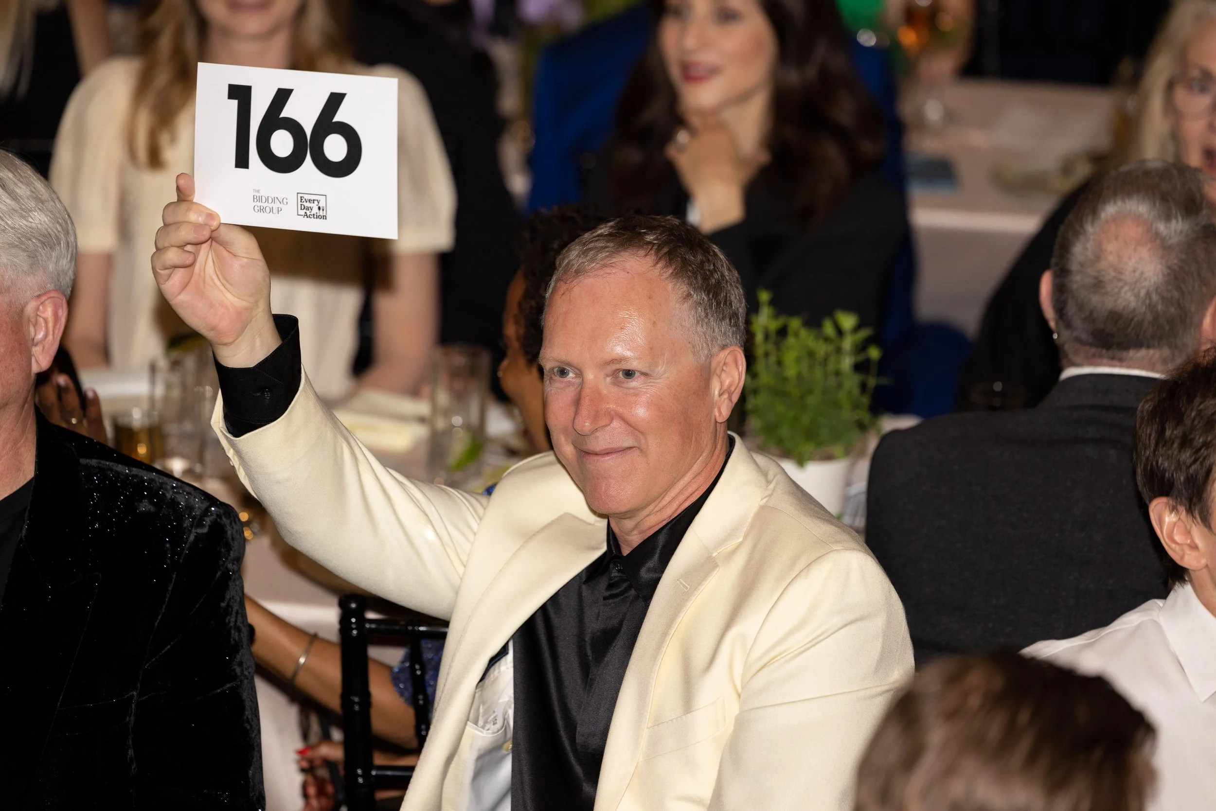 A bid goes up during a live auction at a nonprofit event.