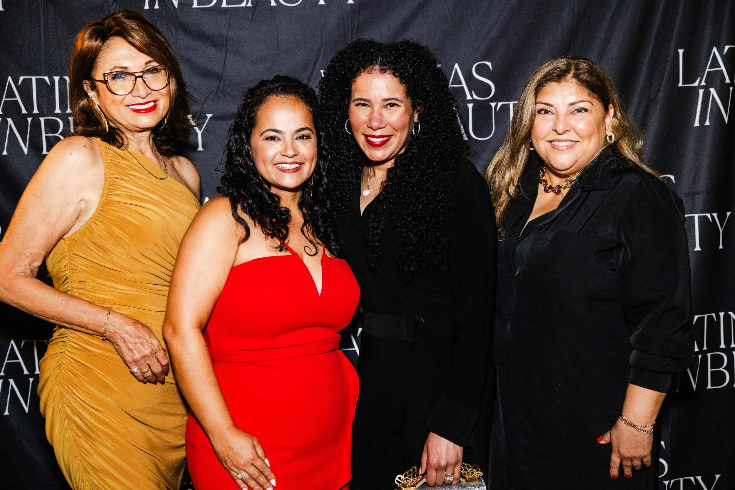 Four women pose on the Latinas in Beauty red carpet at the Beverly Hills launch, highlighting community in Los Angeles event photography.