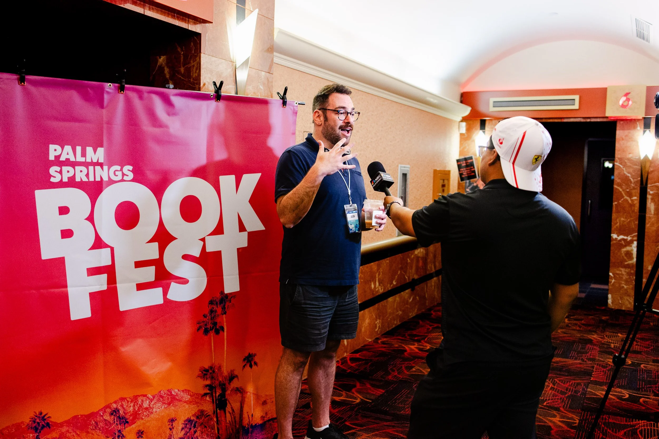 Palm Springs Book Fest founder Jason Biltman being interviewed during the festival.