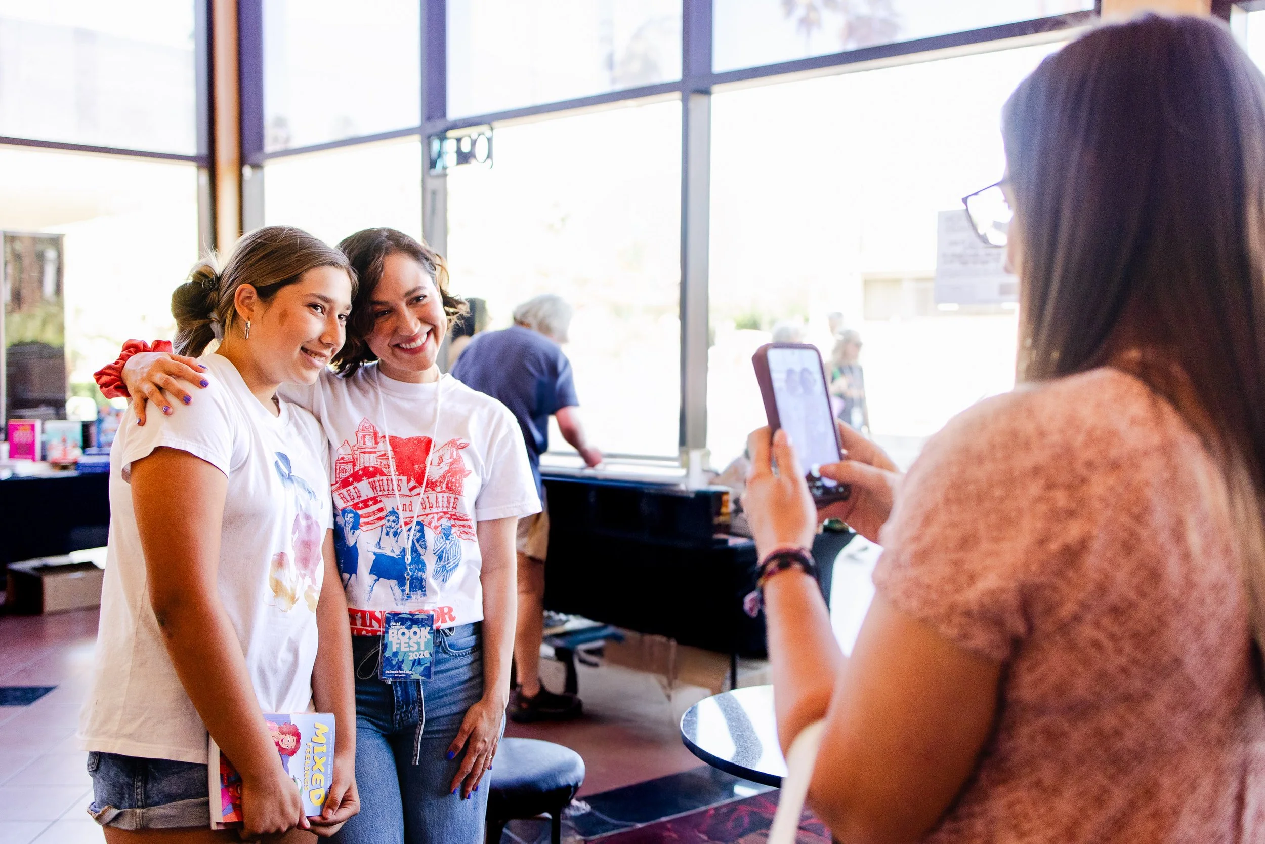 Festival attendee taking a photo with an author at Palm Springs Book Fest.