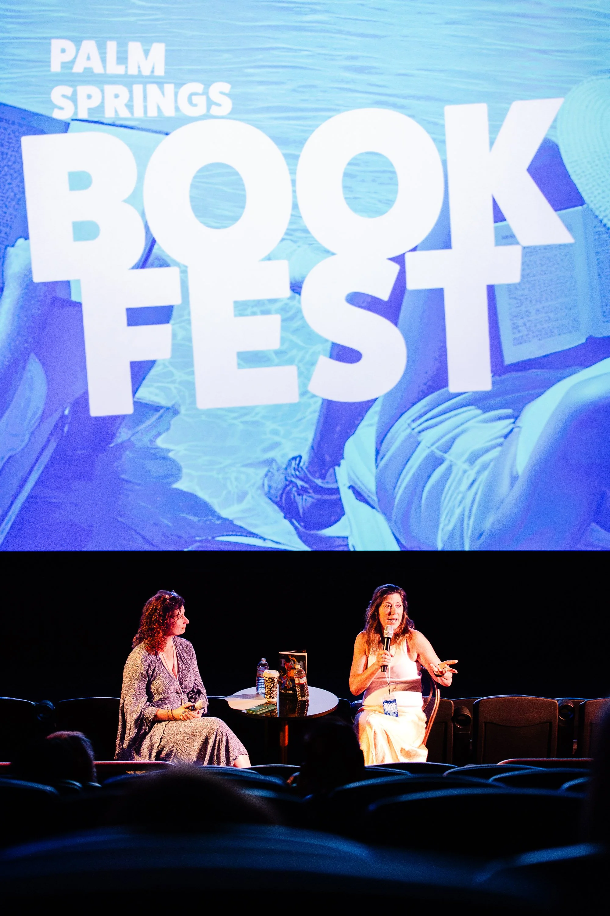 Speaker participating in an author conversation onstage at Palm Springs Book Fest.