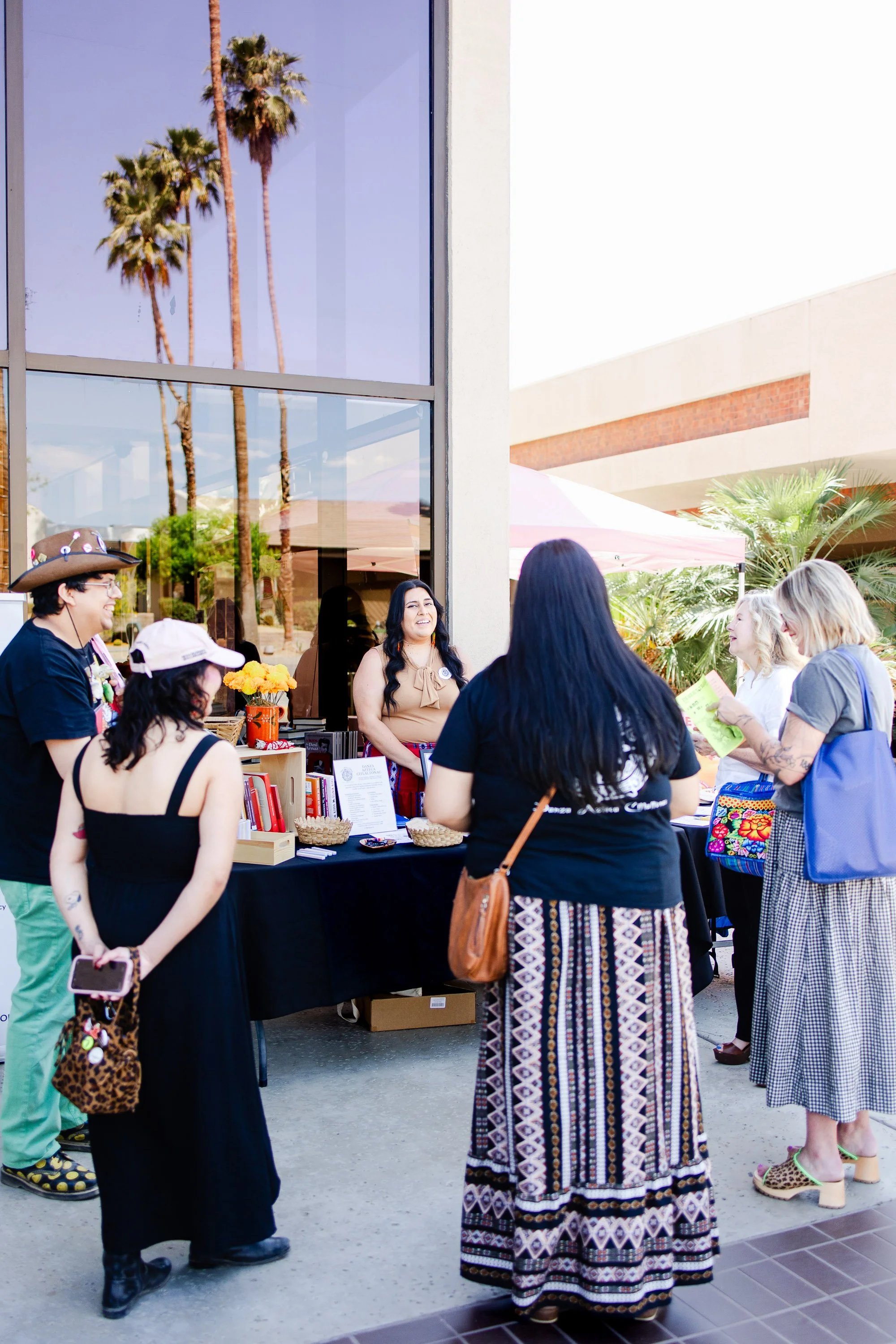 Attendees gathering outdoors during the Palm Springs Book Fest community events.