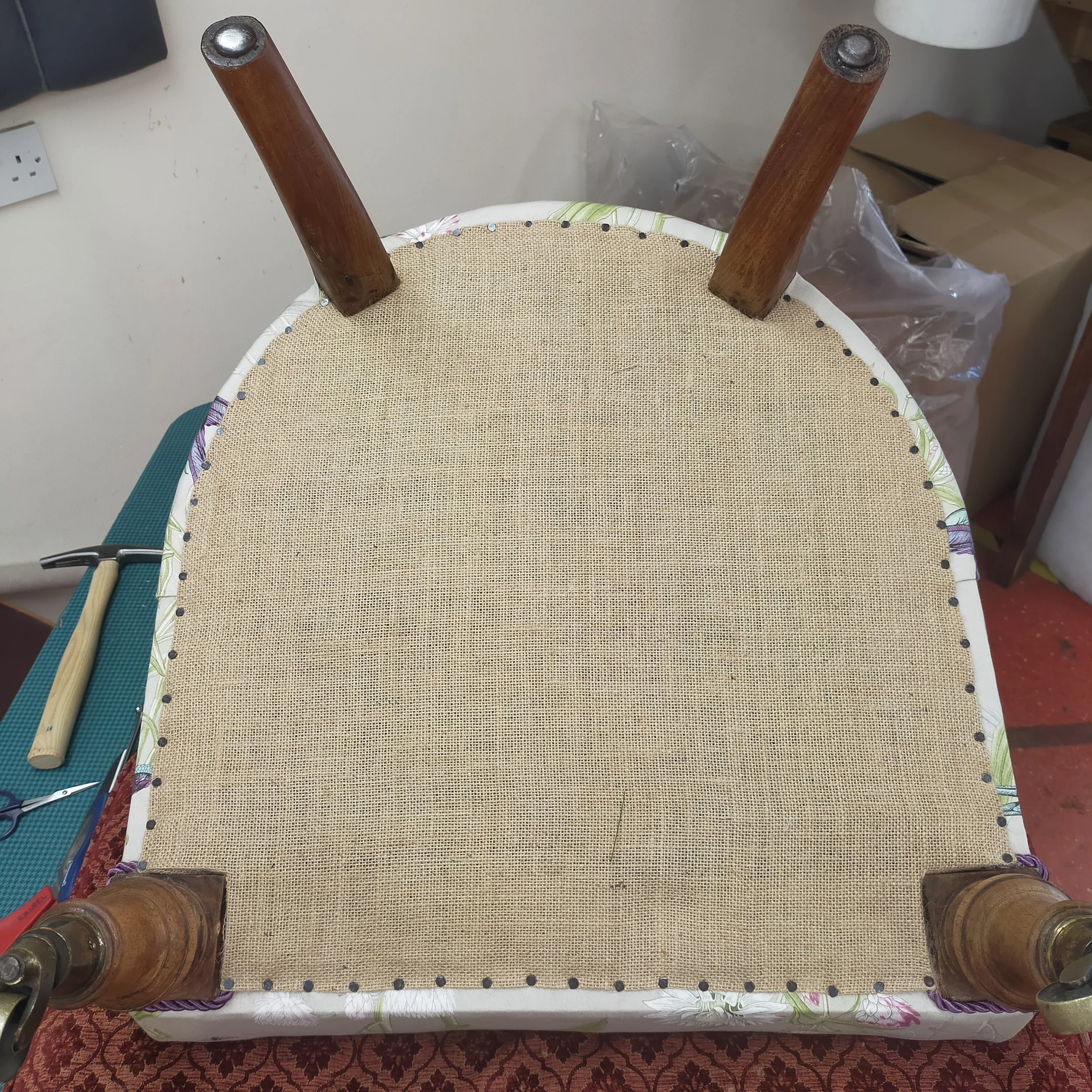 Traditional hessian bottom tacked into position