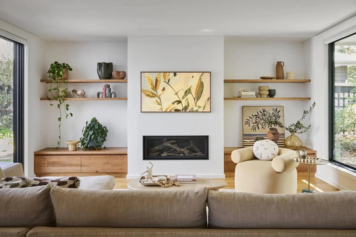 Living room details - light-filled in summer, then drapes drawn &amp; the fire on for cosy winters. 

I love the warmth the messmate timber joinery brings, and I&rsquo;m always a fan of TV art - a simple way to soften the black box so it sits quietly