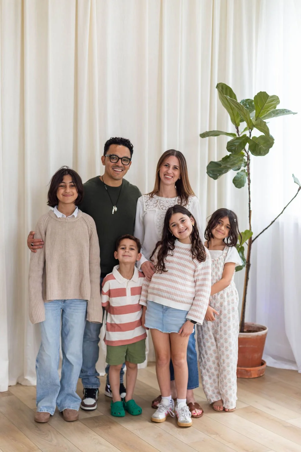 Erin, Columbus Ohio doula, and her family smiling in professional family photo
