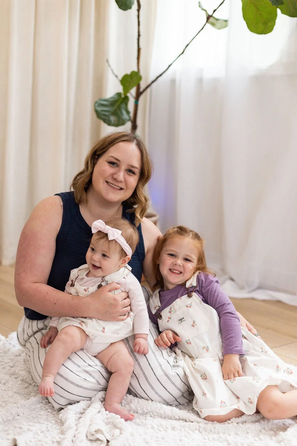 Mallory, Columbus Ohio doula, smiling with her children in professional photo