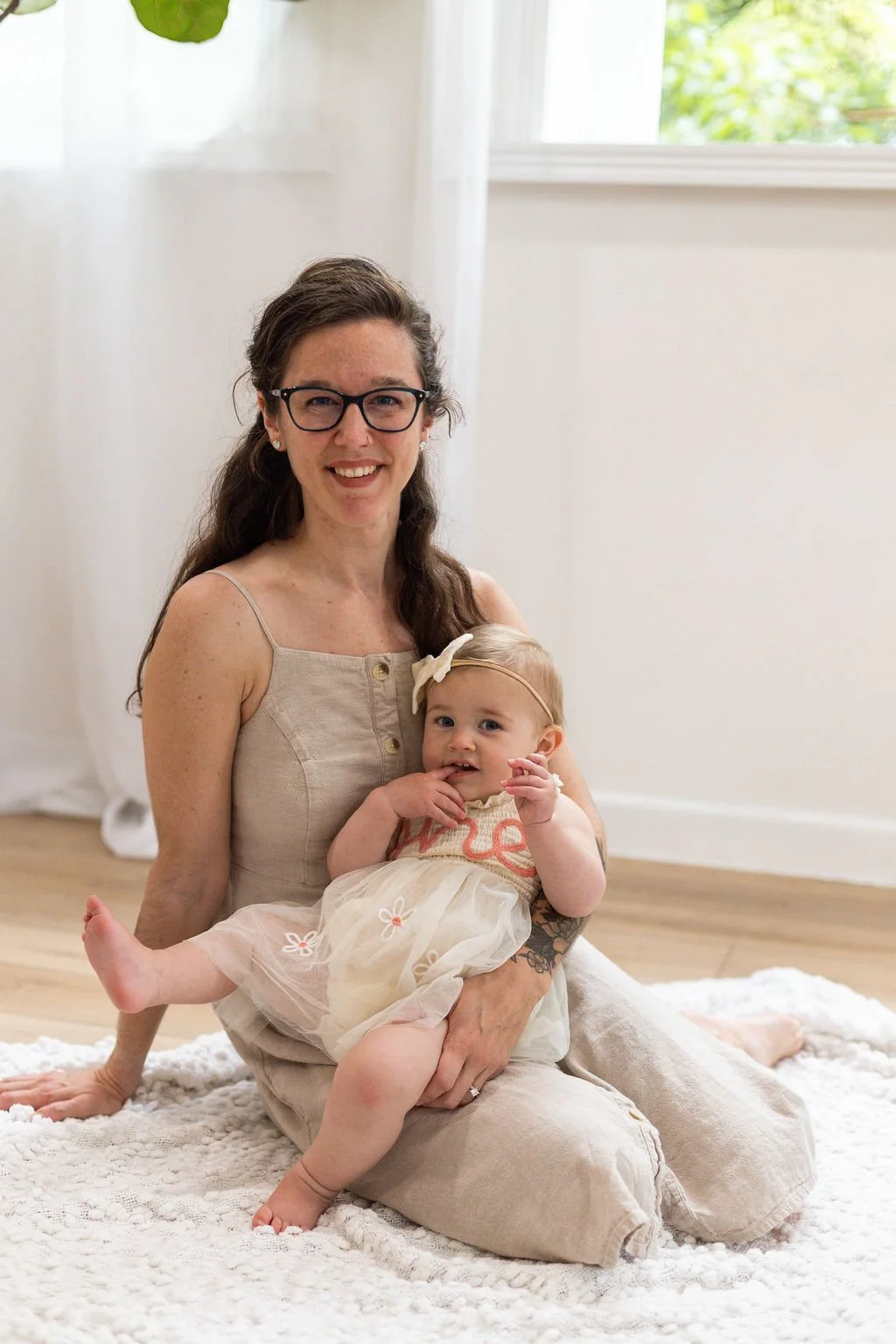 Emily, Columbus Ohio doula, smiling with her child in professional photo