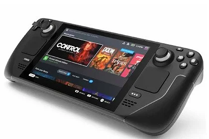 A handheld gaming console with a large screen displaying a game library, control buttons, thumbsticks, and a D-pad.