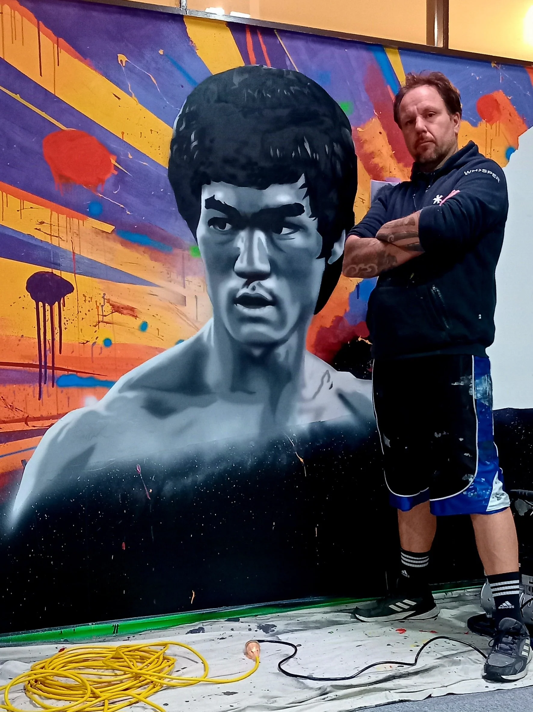 Bruce Lee mural with airbrush