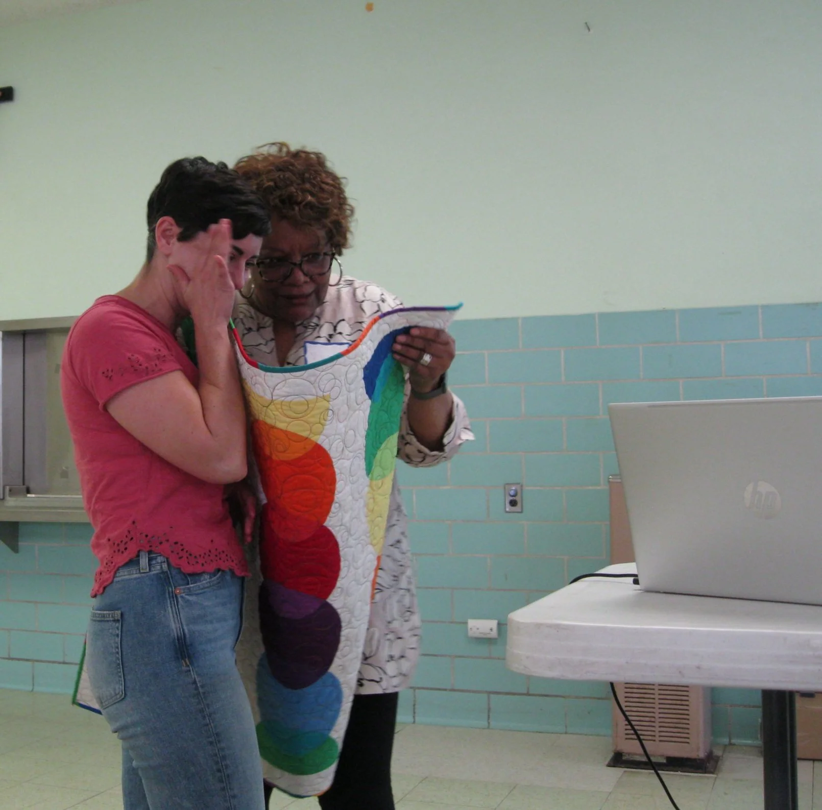 Vivian shares the secret of the quilt with the winner, Tori. 