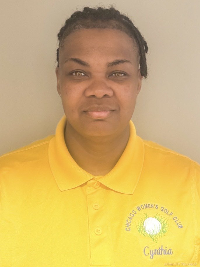 Woman wearing a yellow polo shirt with the logo of the Chicago Women's Golf Club and the name Cynthia embroidered on it.