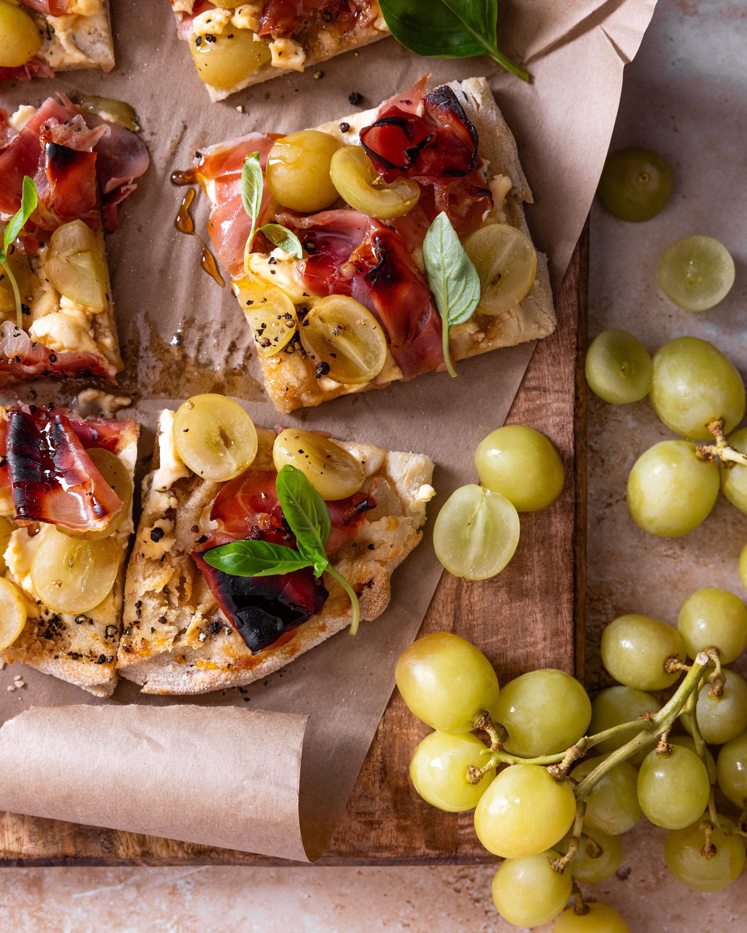 grape pizza with prosciutto, goats cheese & honey.