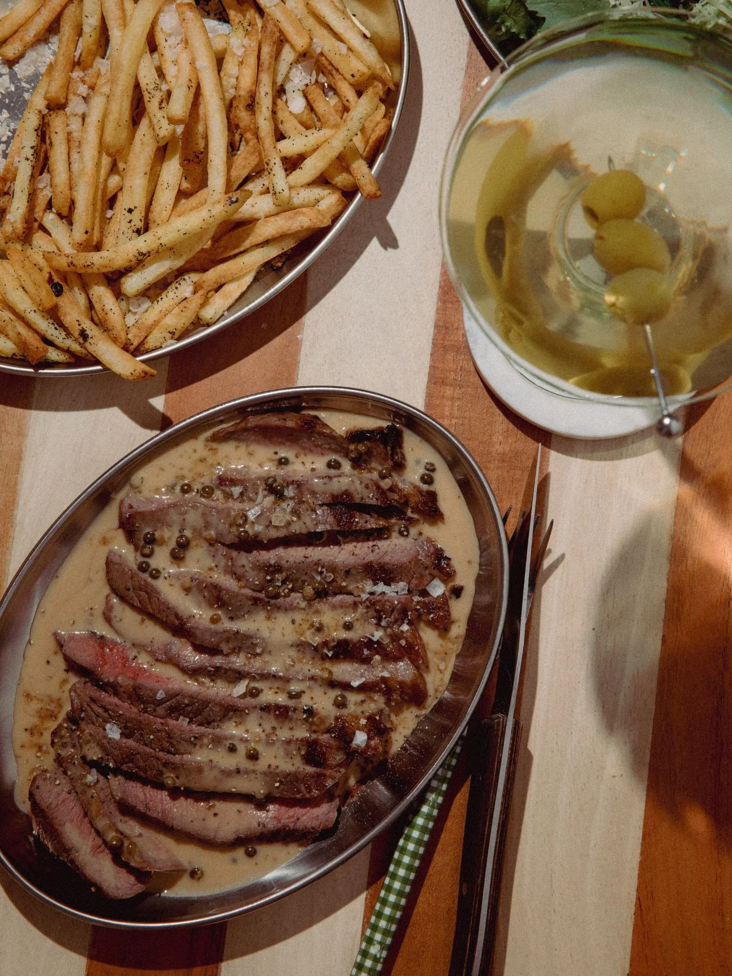 Steak frites with olive martini from Meat on James St