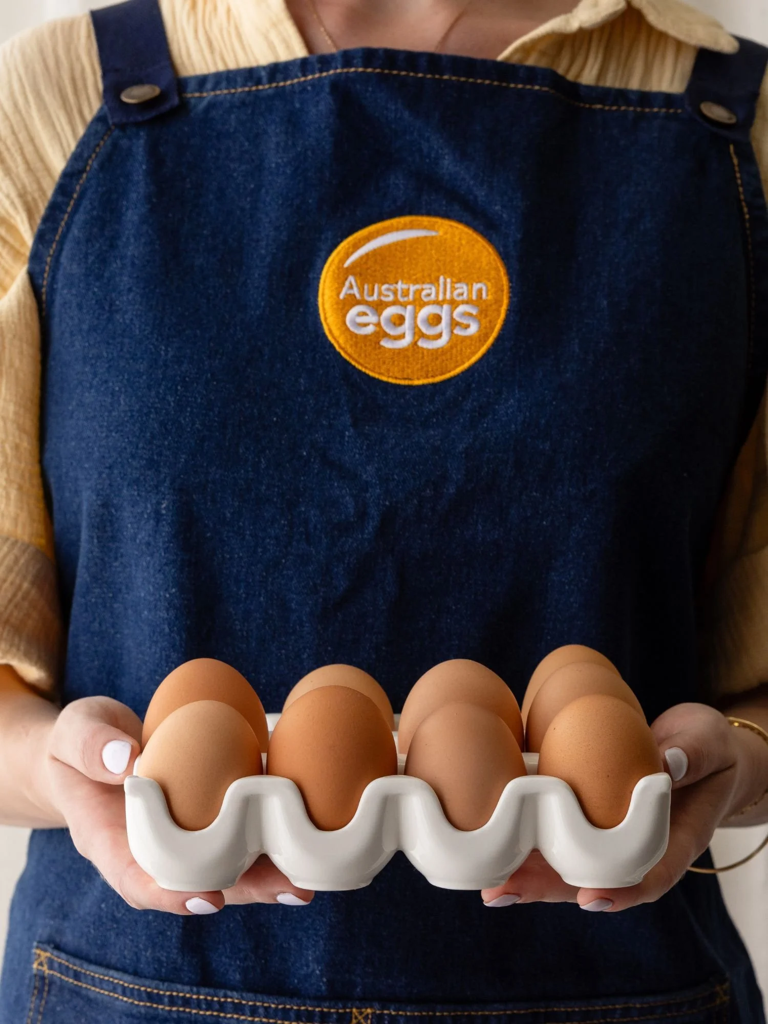 Hands holding eggs from Australian Eggs