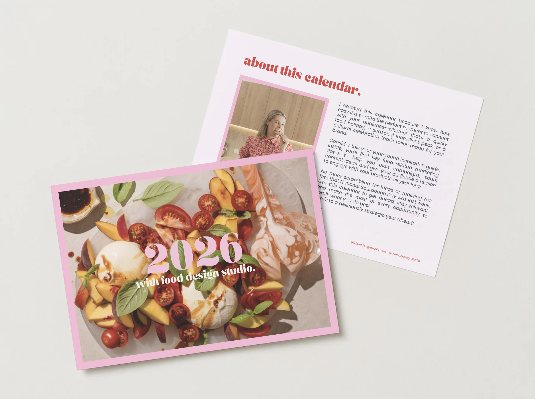 The 2026 Food Design Studio Marketing Calendar cover featuring a colorful dish with cherry tomatoes, sliced peaches, basil leaves, and burrata, along with a photograph of a woman smiling and eating in a wooden setting