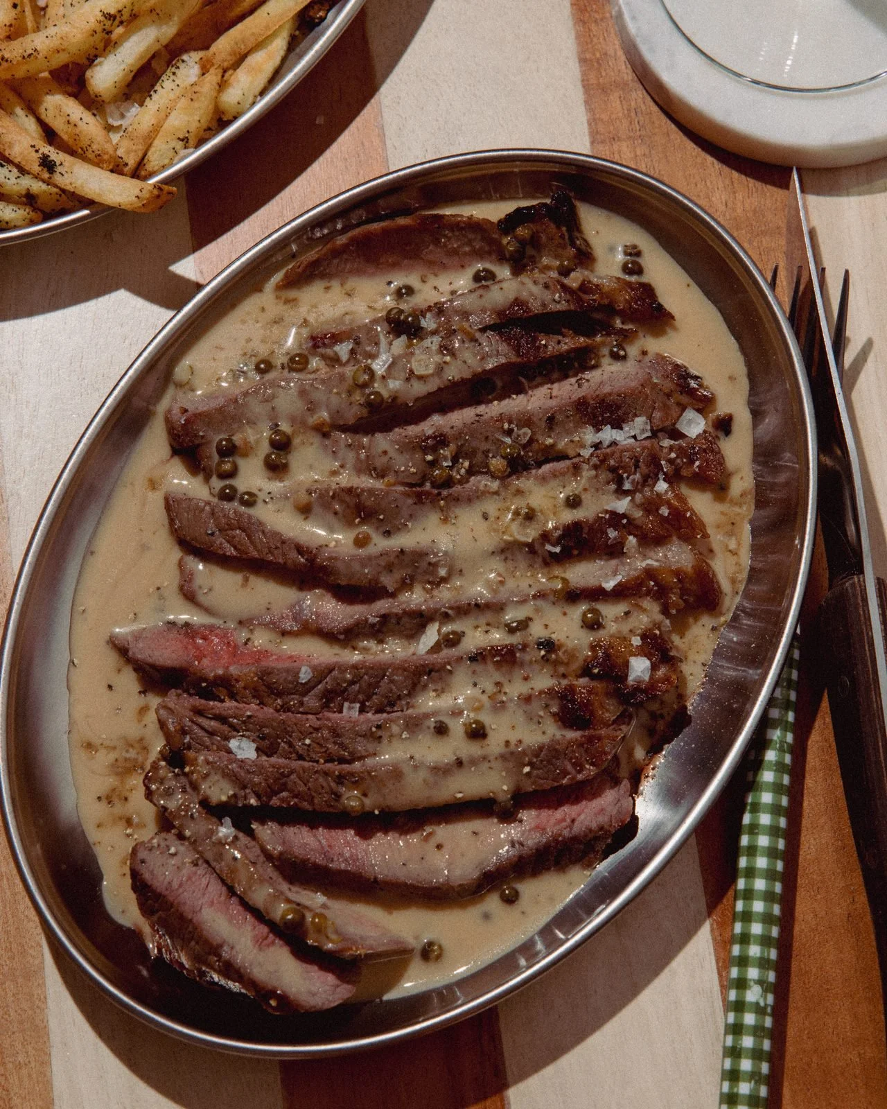 Steak frites with green peppercorn & brandy sauce