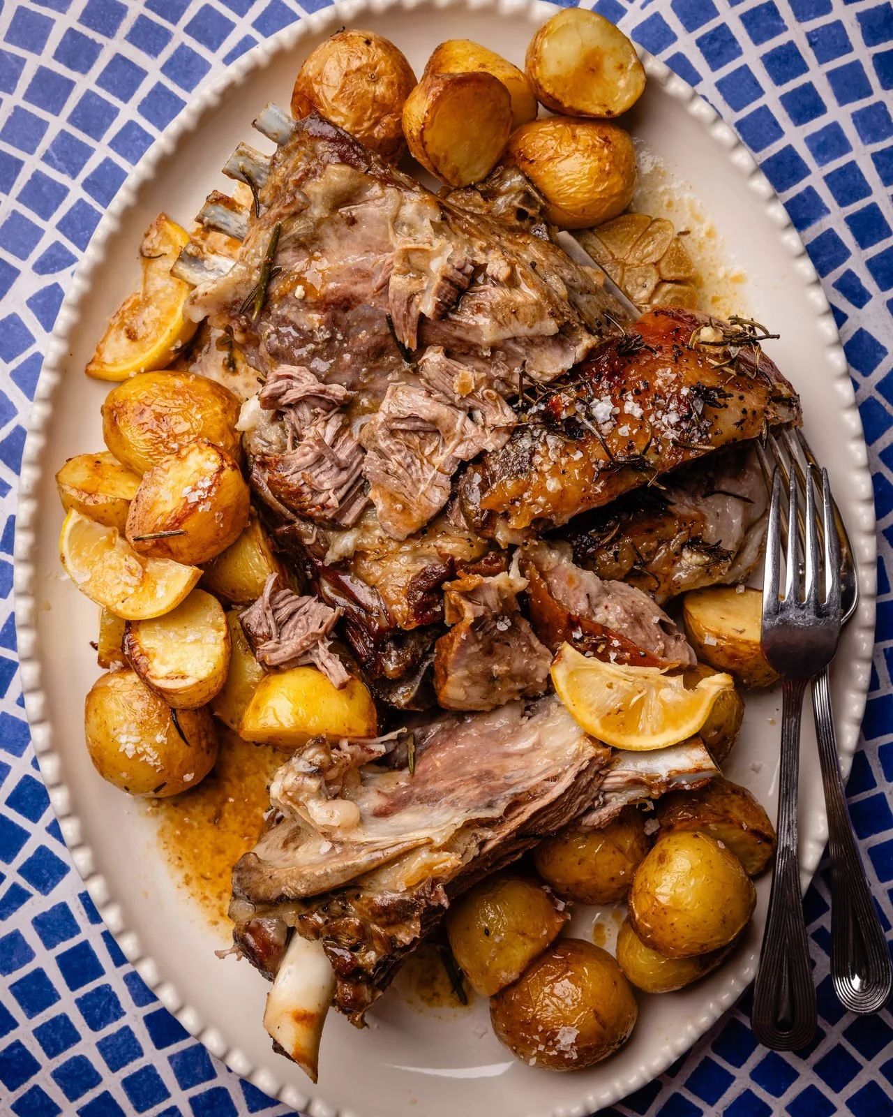 Slow roasted lamb shoulder with lemon potatoes