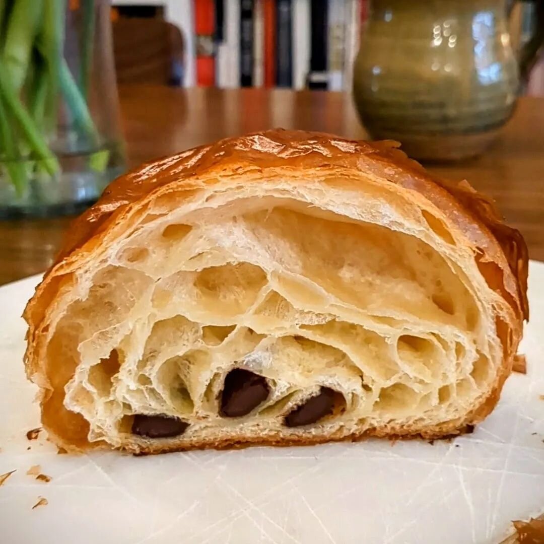 It's been a while since I posted a picture of the inside of a pain au chocolat so here's a picture of the inside of a pain au chocolat. 

#sundaybakeday #painauchocolat #croissant #viennoiseries #laminateddough #eatgrandrapids #eatgr #grfood #grandra