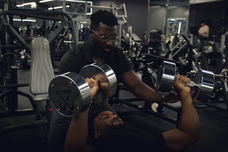 Personal training form coaching at Crown Fitness in Costa Mesa, CA