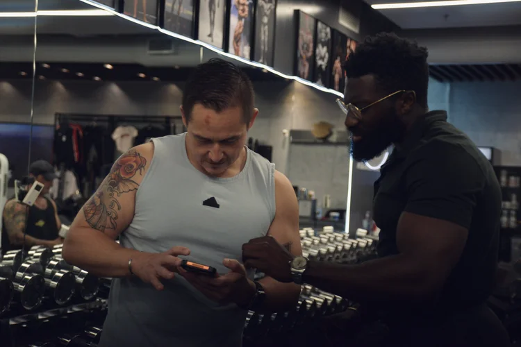 Crown Fitness personal trainer coaching client in Tustin, CA