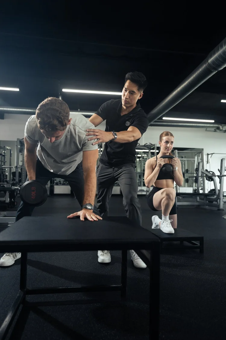 Semi-private personal training dumbbell row coaching at Crown Fitness near Newport Beach, CA