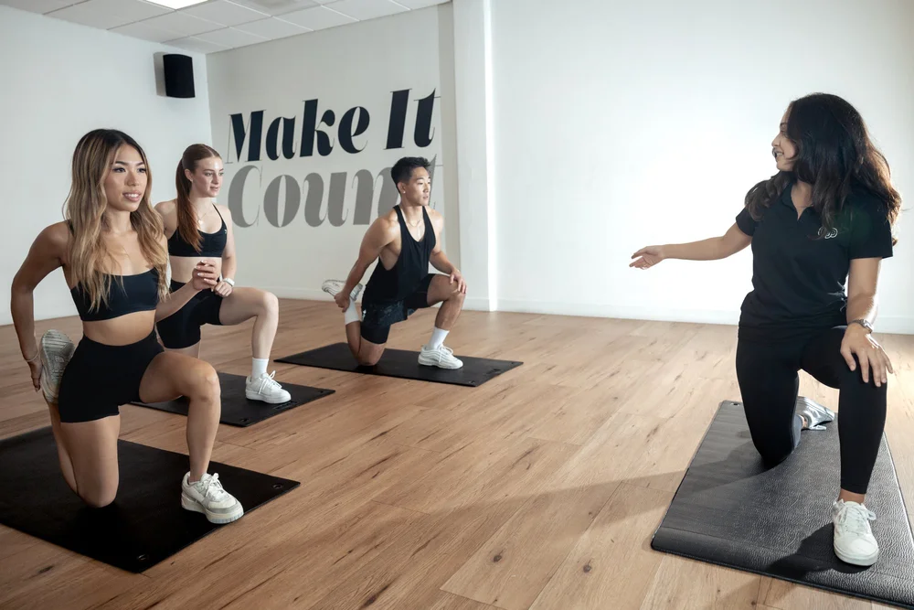 Group personal training mobility warmup session at Crown Fitness in Irvine, CA