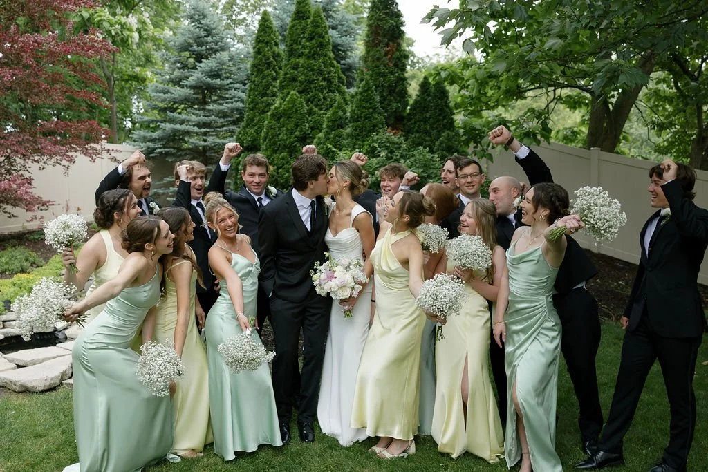 Newlyweds and their bridal party after their ceremony at Holland Gardens