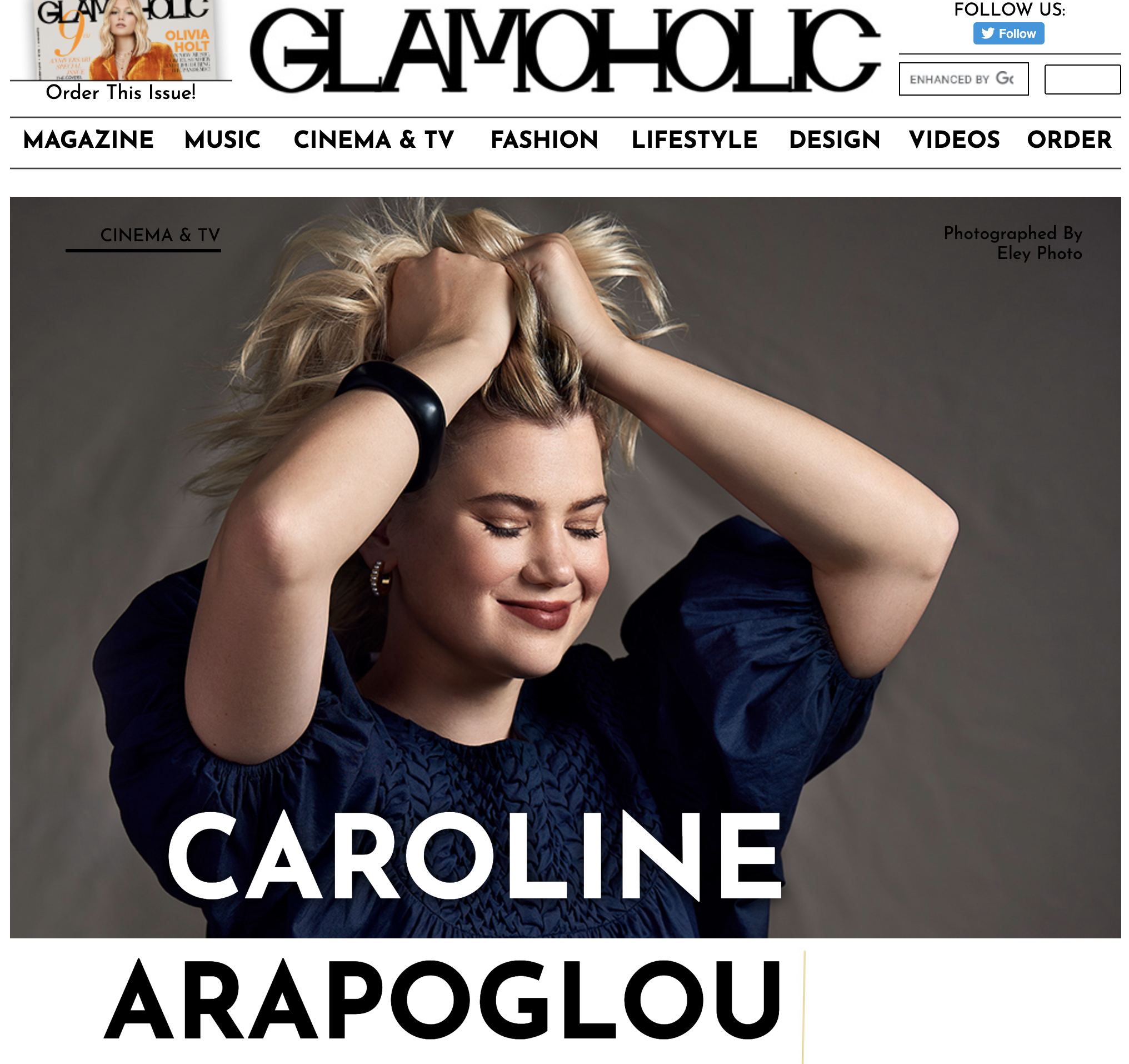 Cover of Glam Hollywood magazine featuring Caroline Arapoglou with blonde hair, wearing a dark blue top, smiling with eyes closed, holding her head with both hands.