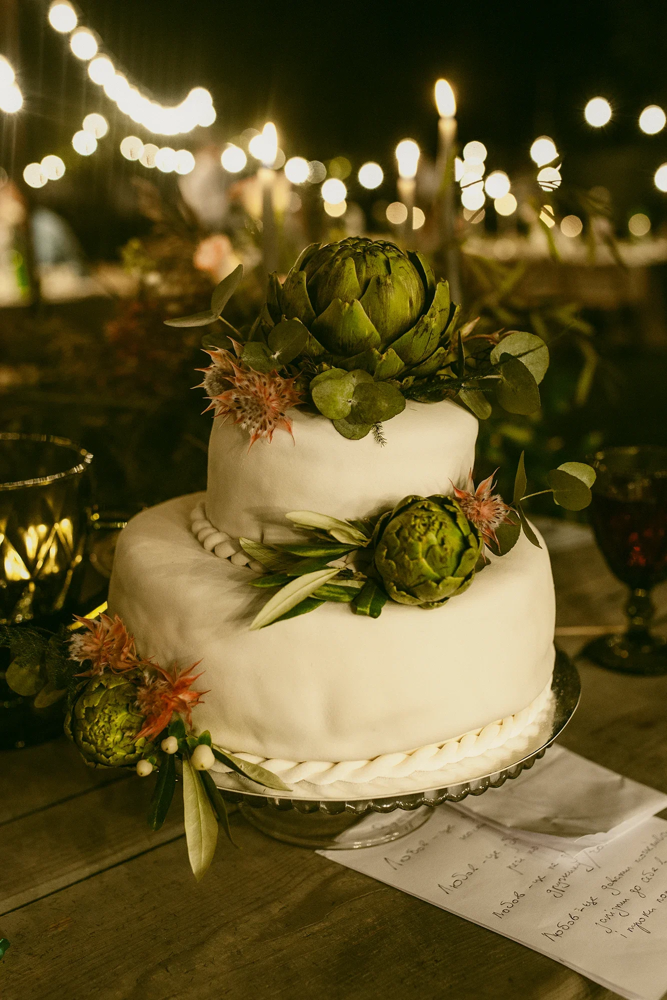 Wedding cake decorated with fresh artichoke.webp