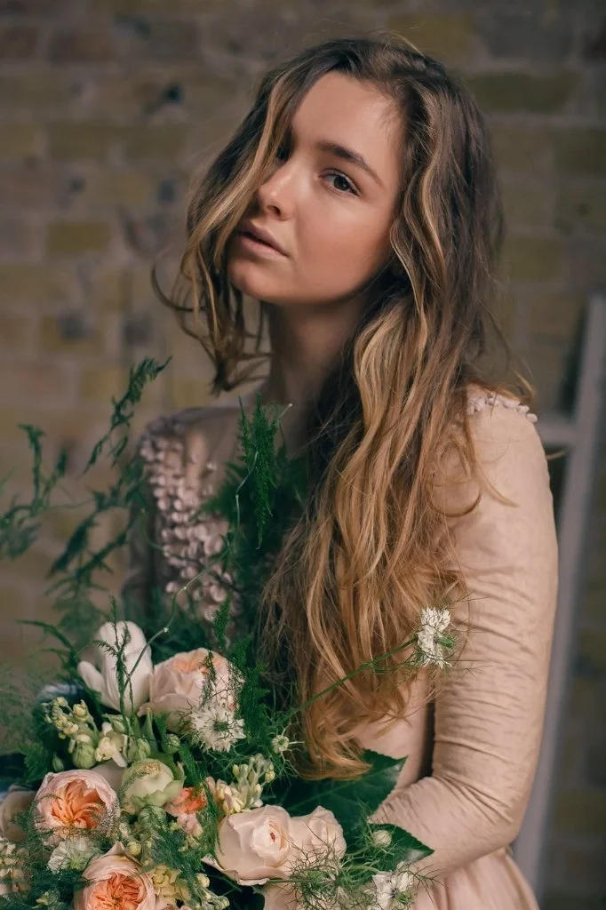 Bride Close-Up Portrait with Bouquet in Golden Dress.webp