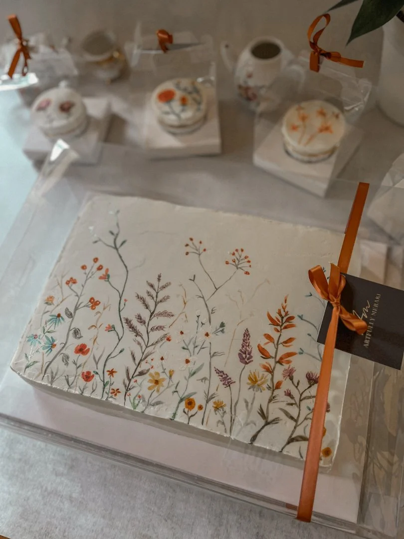 Packaged sheet cake with hand-painted floral design and black tag tied with a copper ribbon, Grand Rapids, MI