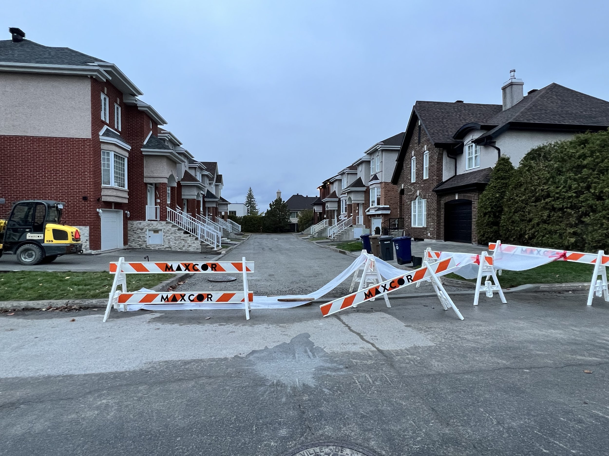 8_MAXCOR_Construction_Montreal_Laval_Regrade_Repave_Street_Driveways.jpeg