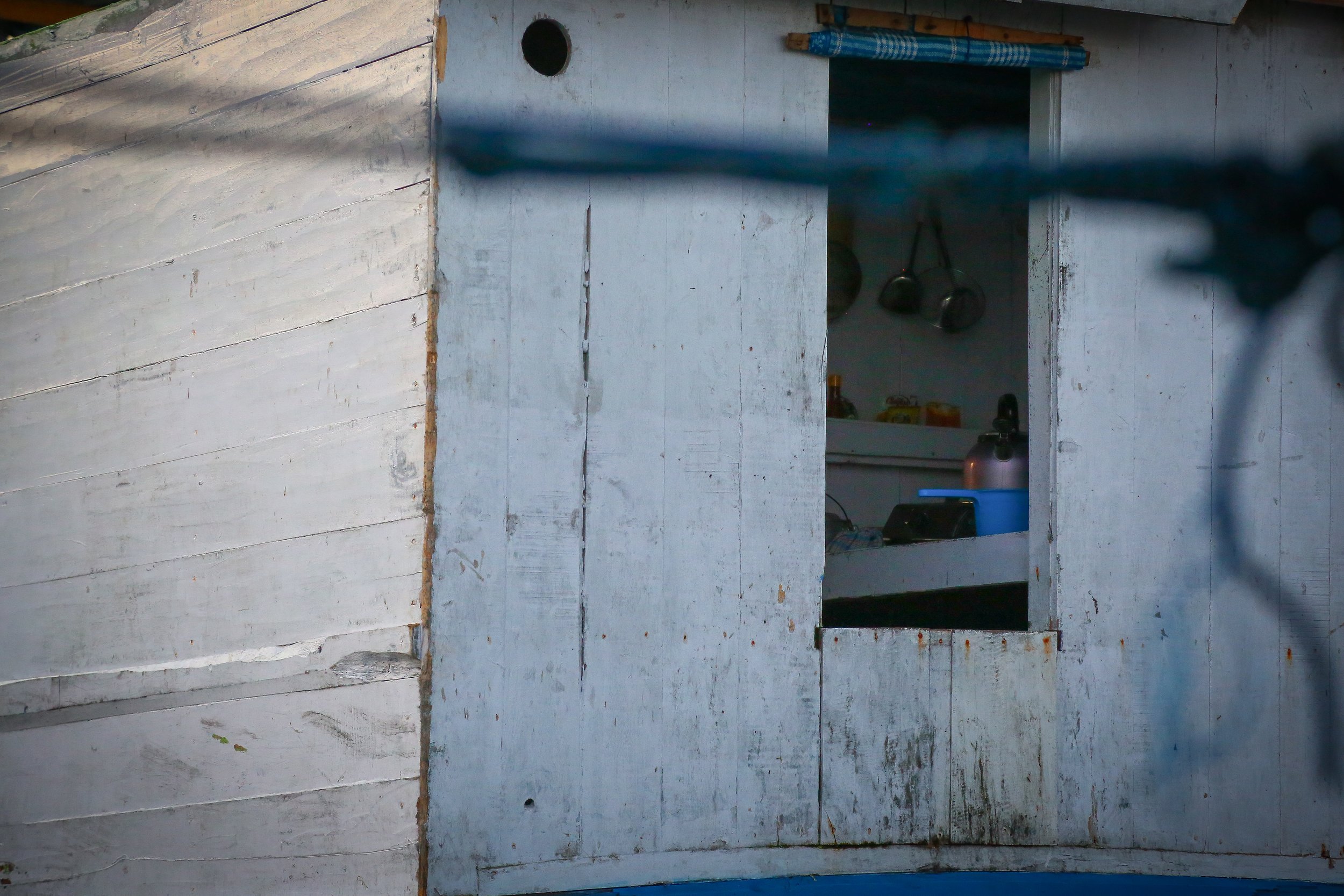 A kettle sits in a house boat in the harbor of Labuan Bajo, Flores.