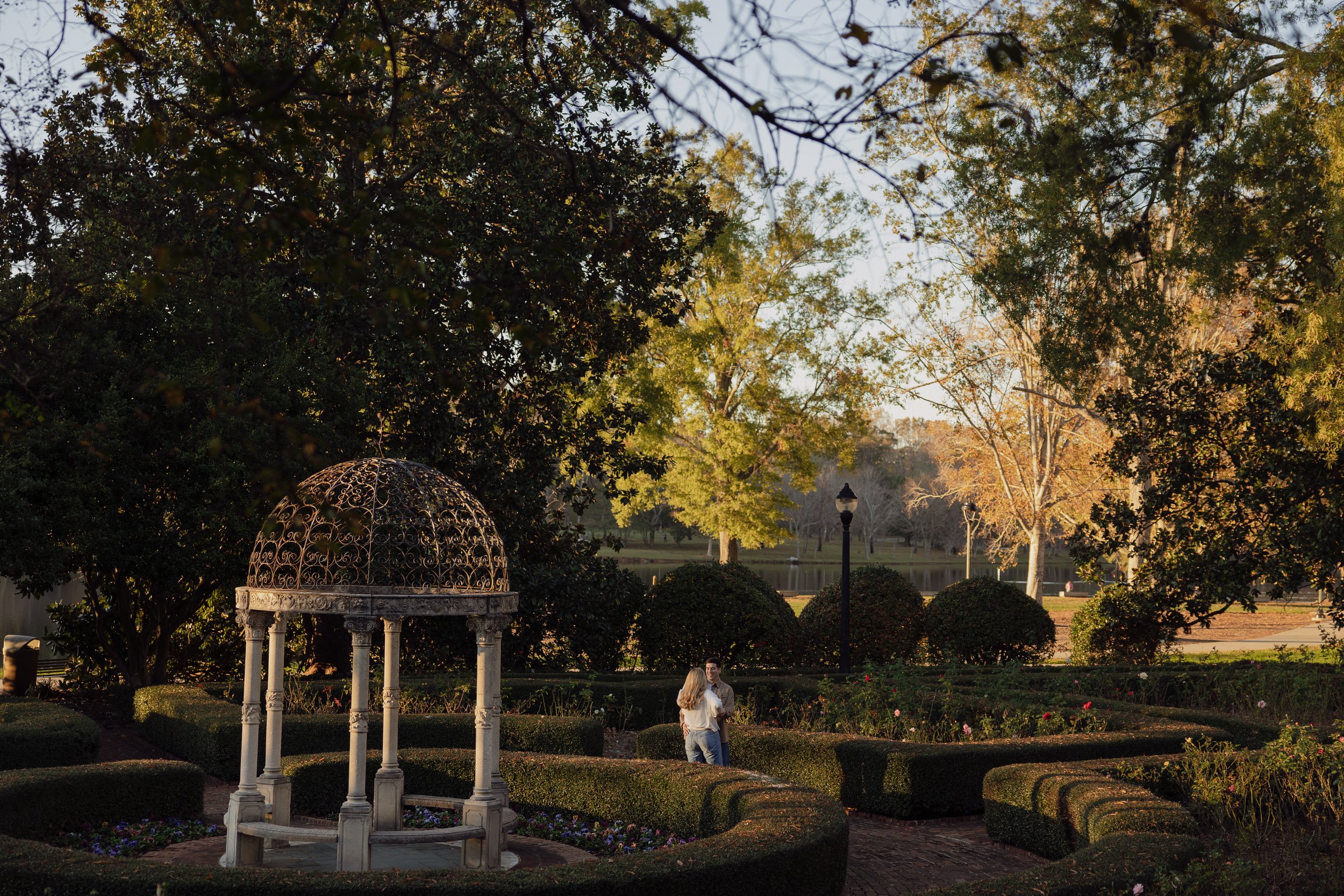 Cinematic engagement photoshoot at the Rose Garden at golden hour at Furman University.