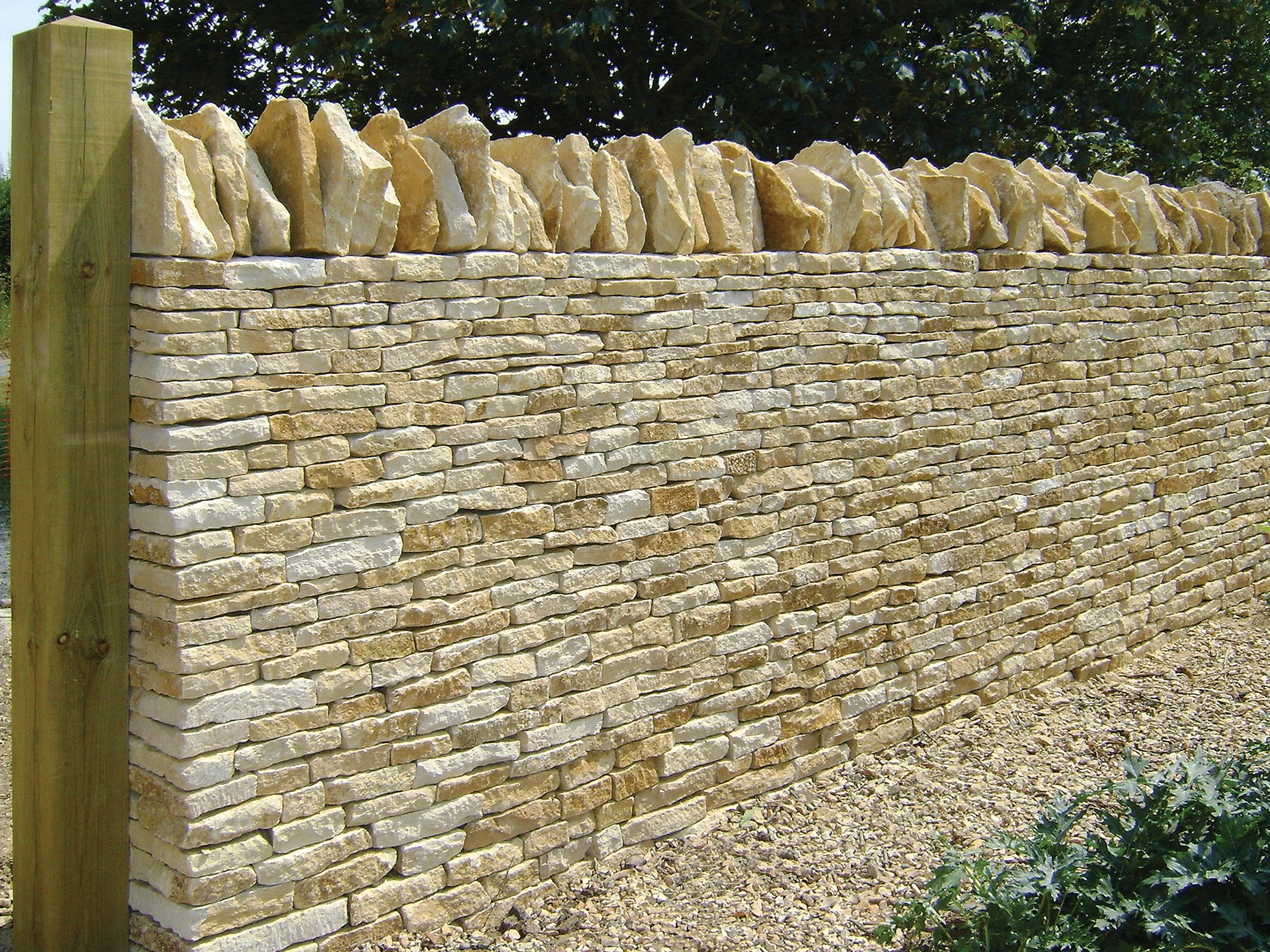Close up of dry stone wall in the cotswolds using natural local stone