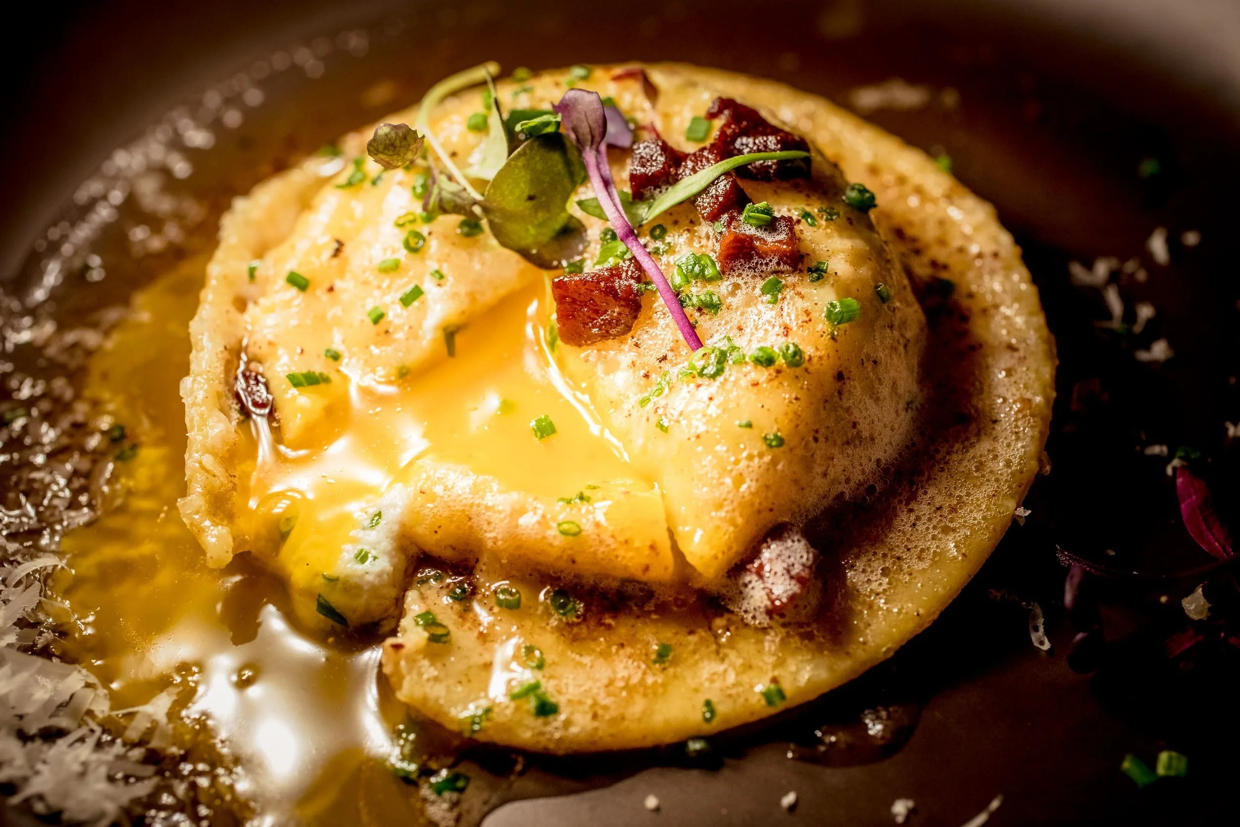 close up of egg yolk ravioli