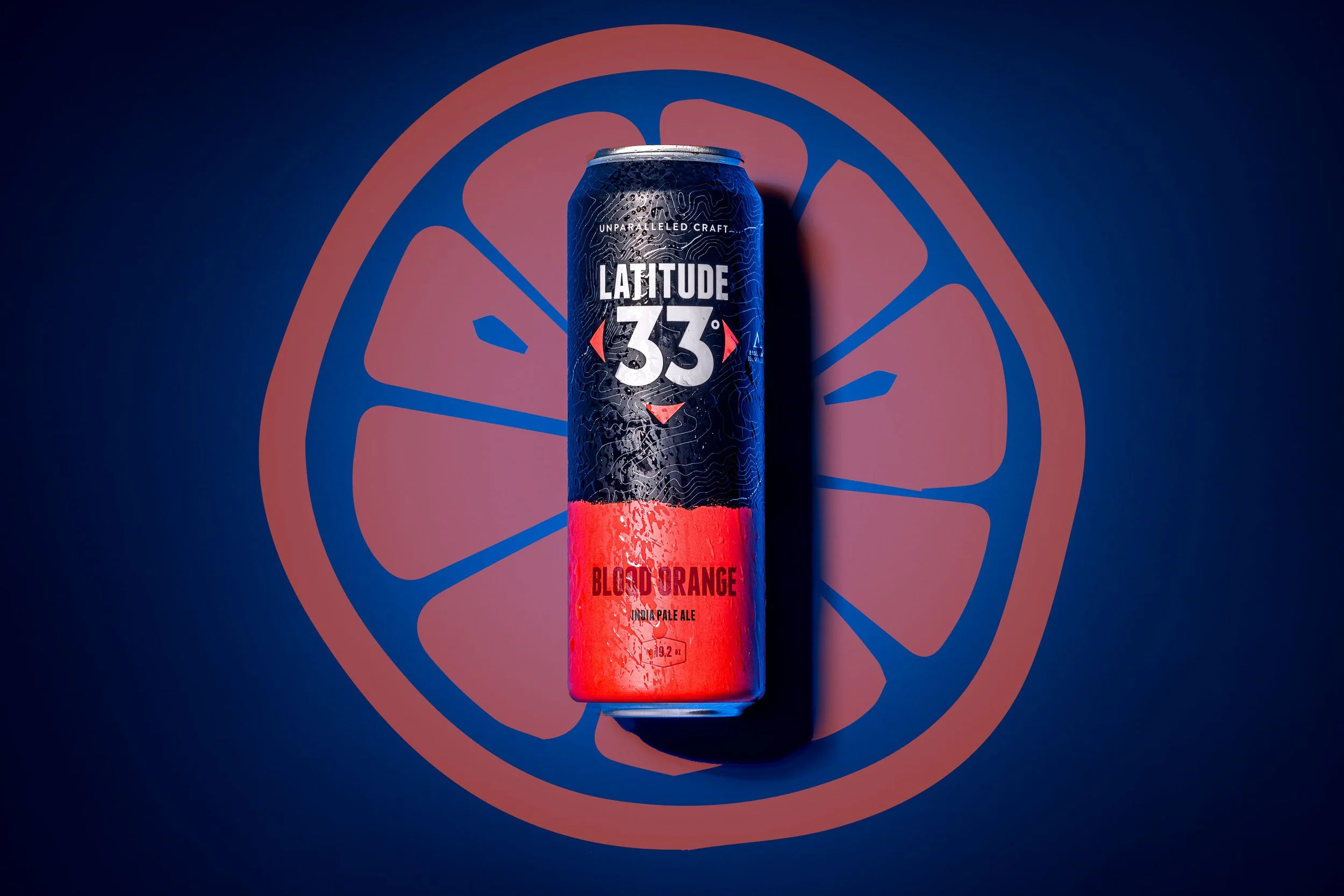 Product photo of a can of beer on a blue background
