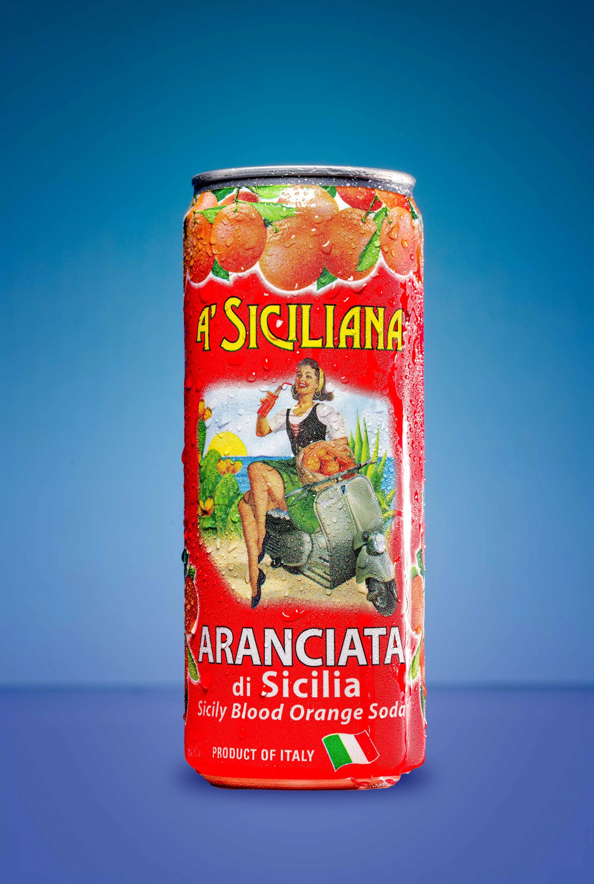 Product photo of an orange can of Italian Soda on a blue background