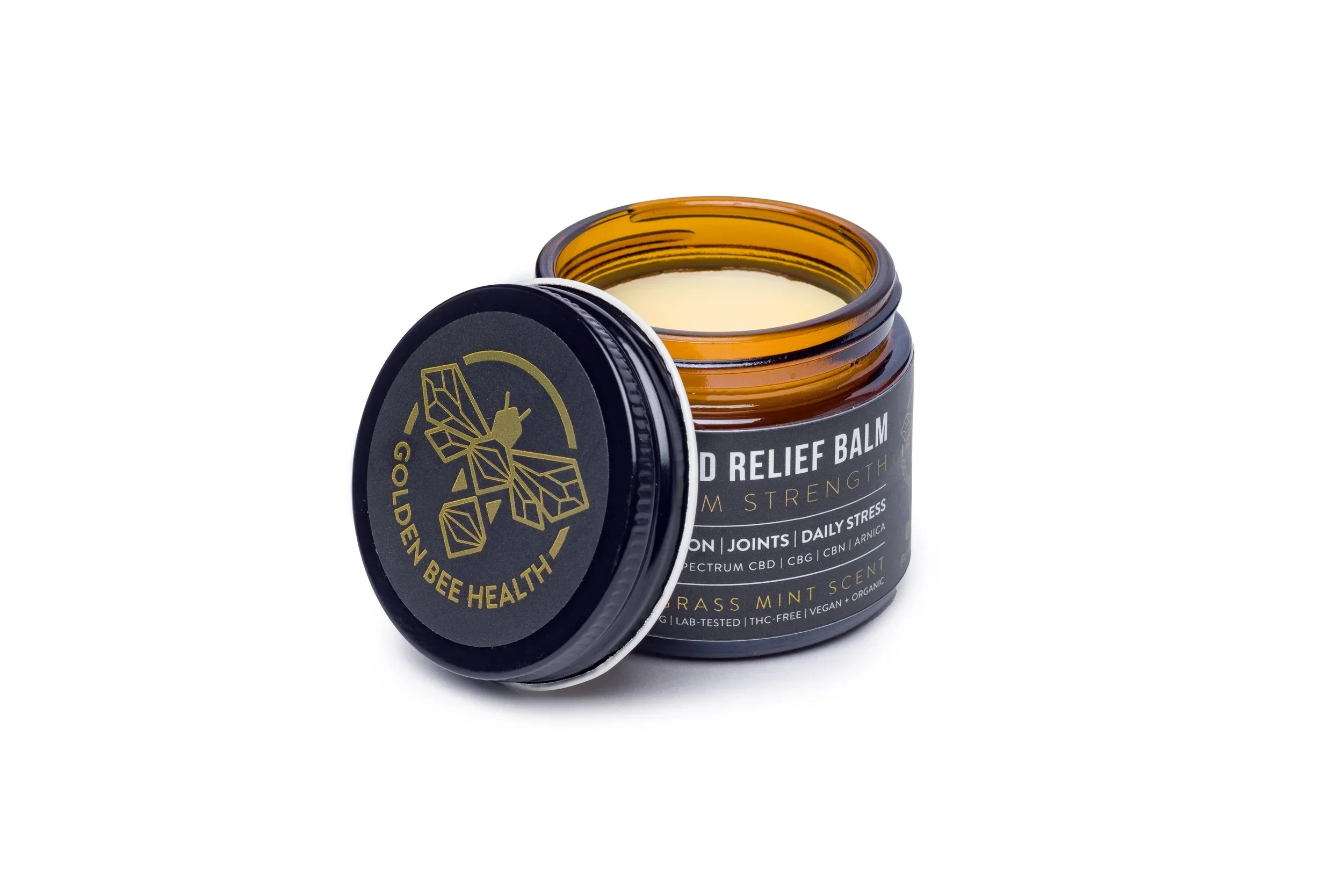 Product photo of an open balm jar on a white background