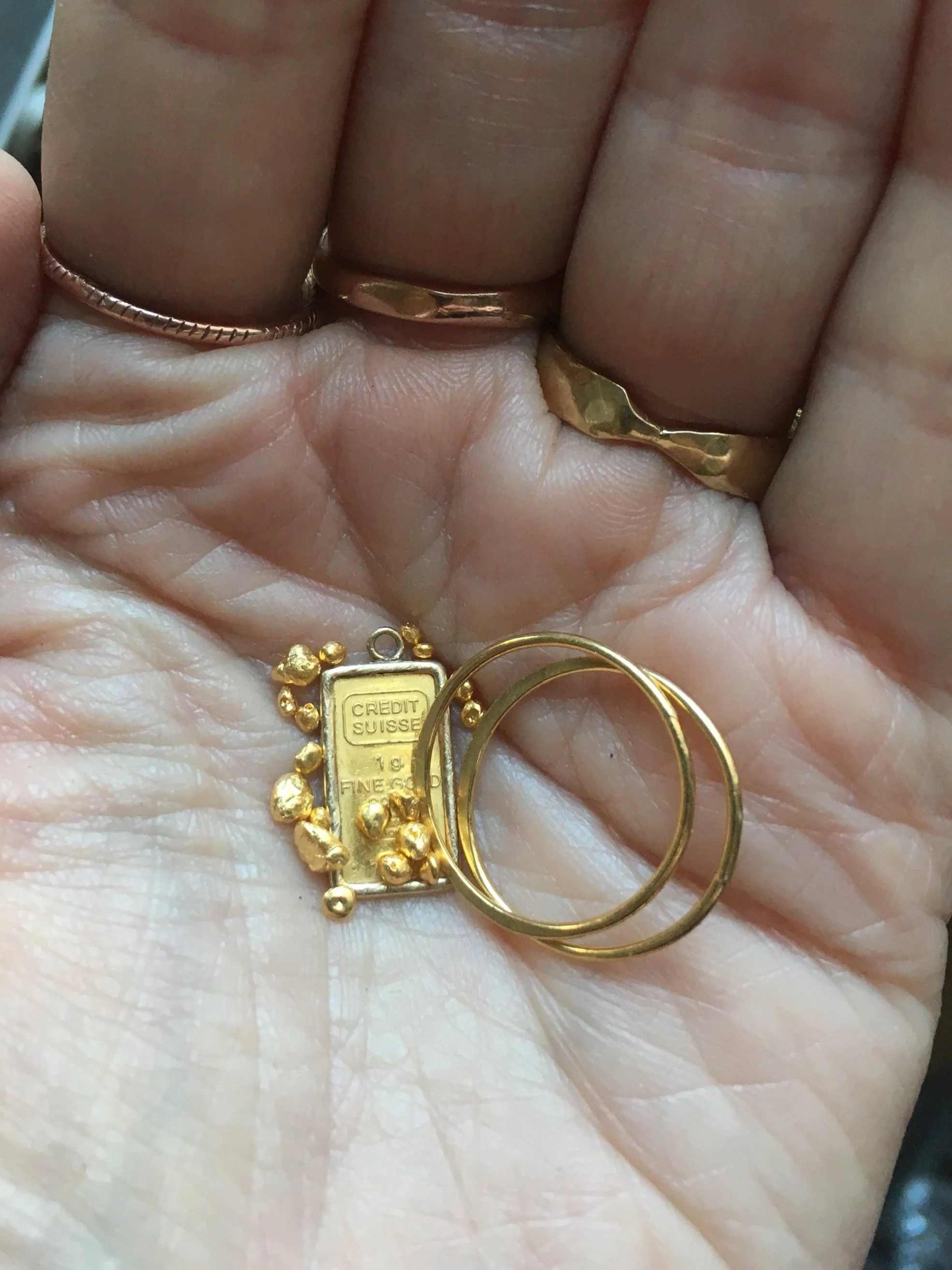  Holding gold money in the palm of my hand. 