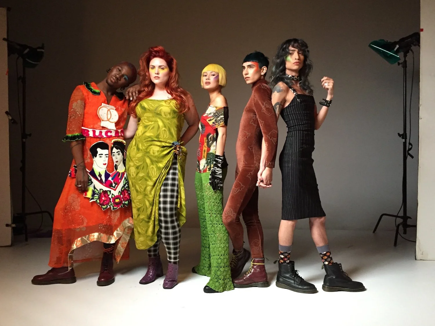 A colorful group of millennial models with red, yellow, smoky ash, and green hair celebrate diversity, individual styles, and beauty.