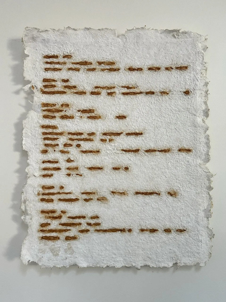 "OXIDATION OF WORDS AND TRUTHS" by Donna Hall; handmade paper, abaca / cotton, rust, acrylic; 2024